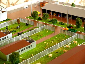 The central flowerbed on the farm layout shows trees and bushes