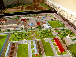 A scale model of a residential district with an adjoining industrial base