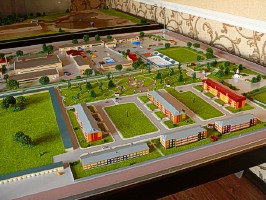 A scale model of a residential district with an adjoining industrial base